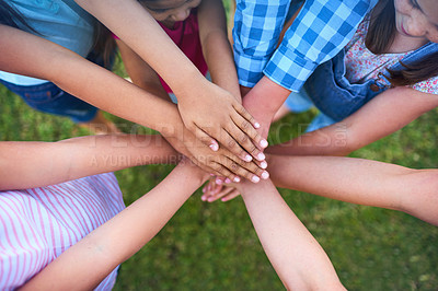 Buy stock photo Cropped shot of a group of kids stacking their hands on top of each other