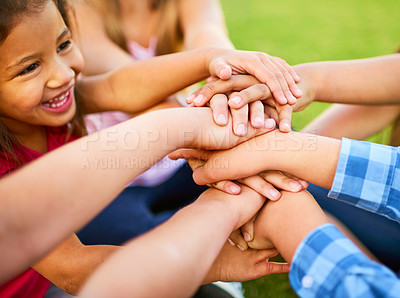 Buy stock photo Cropped shot of a group of kids stacking their hands on top of each other