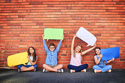 Buy stock photo Kids, wall and happy in outdoor with speech bubble in colors for promotion and advertisement. People, gen z and portrait in smile with creativity for child development as friends with mockup