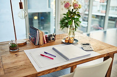 Buy stock photo Remote work, book and desk in creative workplace with paper for writing, planning and idea inspiration. Notebook, space and workspace table for freelance business in home office room for creativity