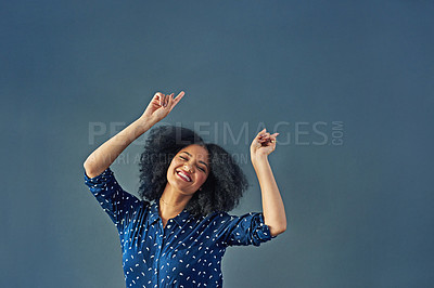 Buy stock photo Portrait, happy and pointing with a woman advertising in studio on a blue background for branding. Smile, silly and hand gesture with a female brand ambassador showing blank or empty marketing space
