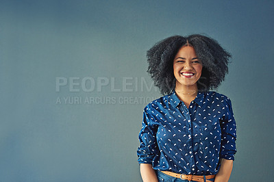 Buy stock photo Studio shot of a happy young woman posing against a gray background