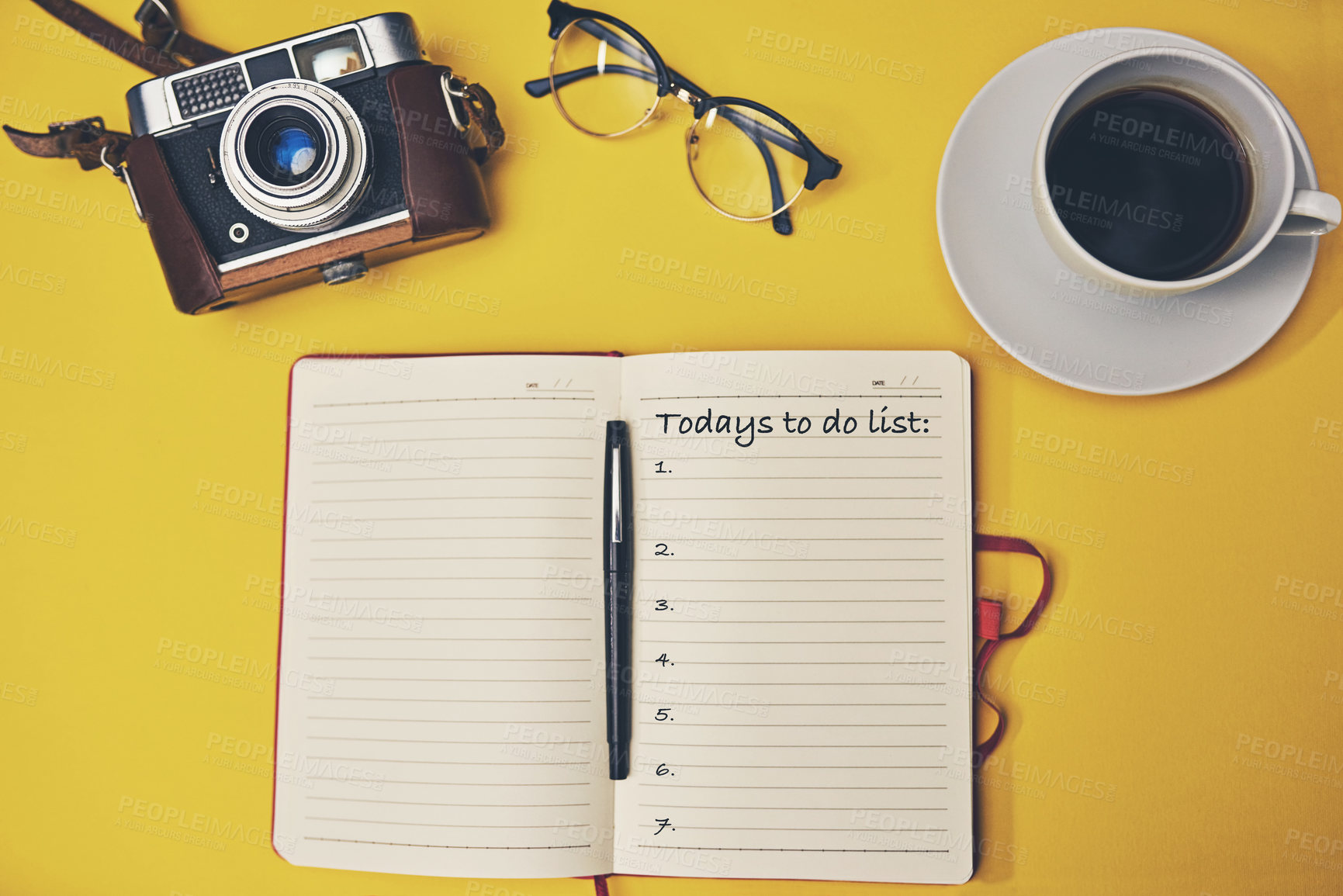Buy stock photo High angle shot of a notebook with a to do list on a yellow desk
