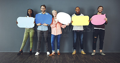 Buy stock photo Studio shot of a diverse group of people holding up speech bubbles against a gray background