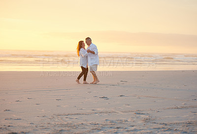 Buy stock photo Shot of a mature couple dancing on the beach