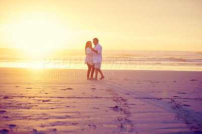 Buy stock photo Full length shot of an affectionate mature couple dancing on the beach at sunset