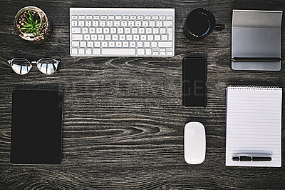 Buy stock photo Table, plant and workstation with keyboard, flat lay and high angle of equipment, creative and tea. Office, wood and notebook for planning in business, above and glasses on desk, coffee and tech