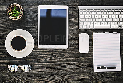 Buy stock photo High angle shot of a variety of wireless devices on a work desk