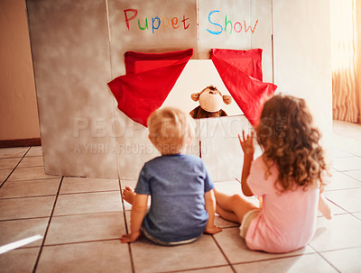 Buy stock photo Puppet show, wave and relax with children on floor for theatre, creative play and fantasy cinema. Storytelling, games and performance with family and cardboard stage at home for youth entertainment