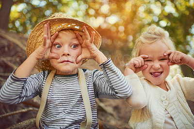 Buy stock photo Silly, boy and girl with funny face, friends and playful in nature, young and joy in summer and relax. Morning, outdoor and siblings on tree, portrait and happiness together, holiday and countryside