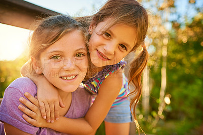 Buy stock photo Portrait of two little girls playing together outdoors
