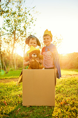 Buy stock photo Portrait of two little boys dressed up in costumes and playing together outdoors
