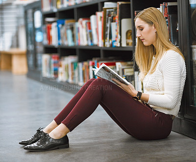 Buy stock photo University, student and reading magazine in the library floor or free time studying or information and knowledge in college. Research, learning and scholar or analysing or book and academic journal 