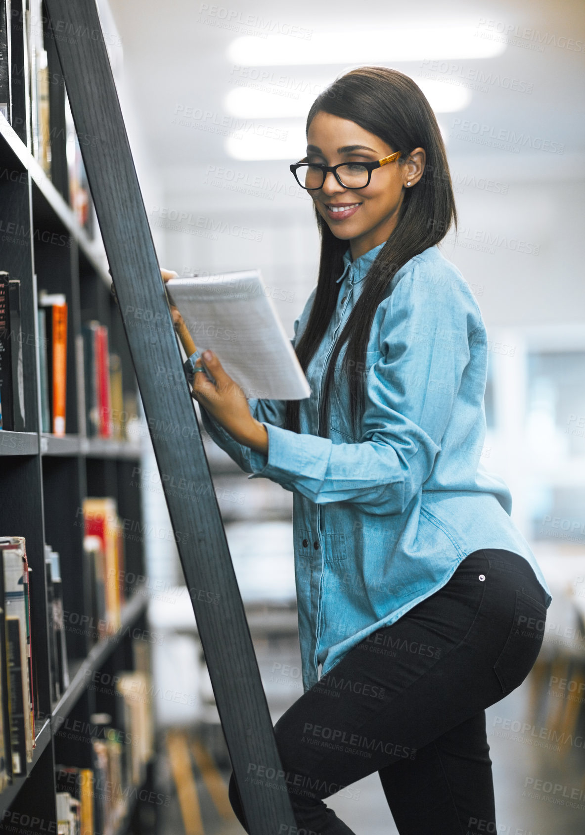 Buy stock photo Woman, college student and happy on bookshelf with ladder for text book and research with notebook. Female person, university learner and smile at library for education, literature and knowledge