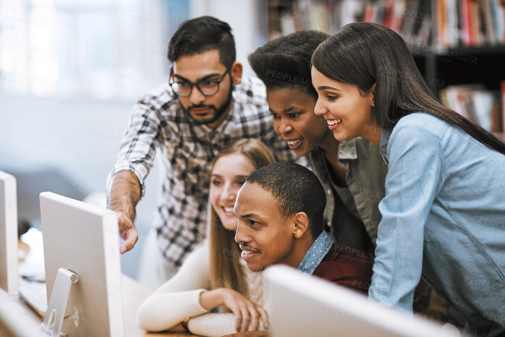 Buy stock photo Cropped shot of university students checking out social media platforms on campus