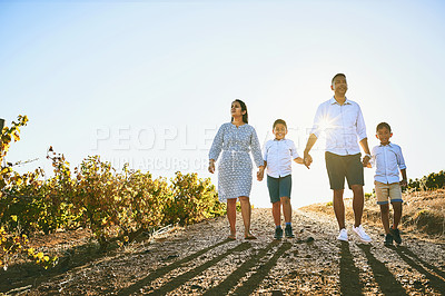 Buy stock photo Shot of a happy family bonding together outdoors