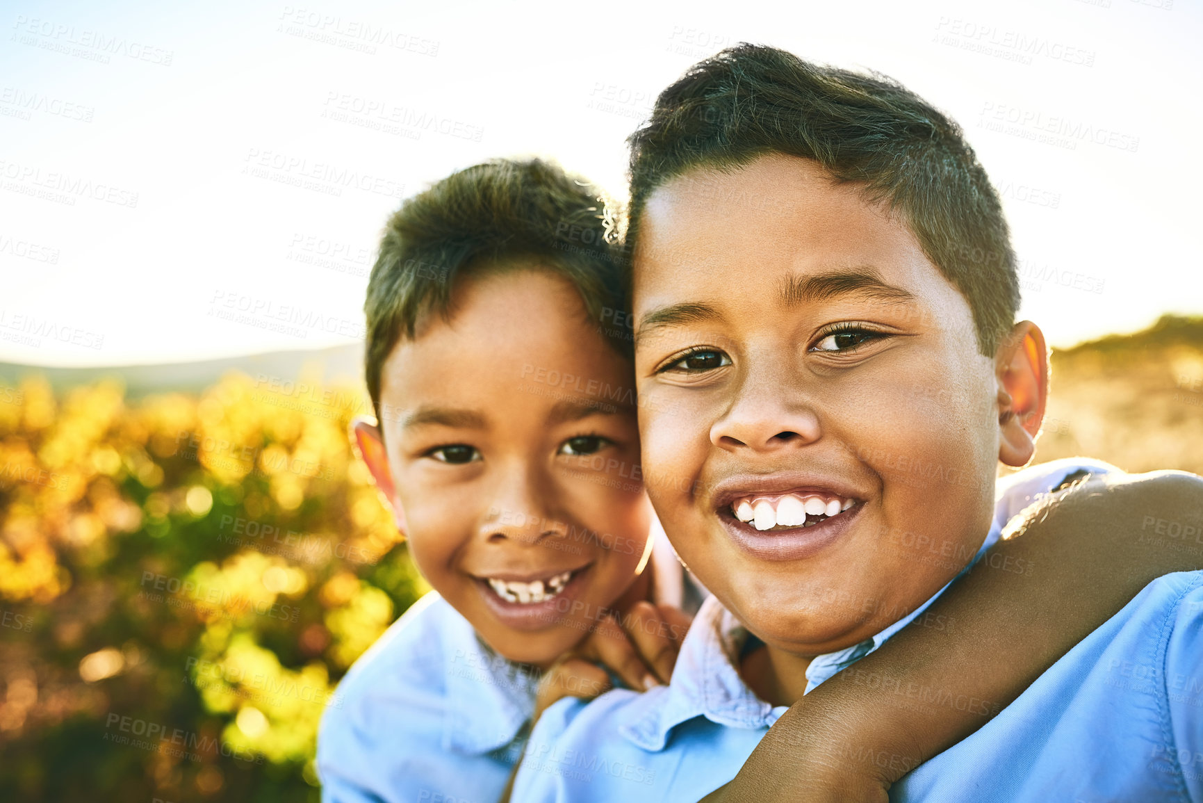 Buy stock photo Portrait of two little brothers taking a selfie together outdoors