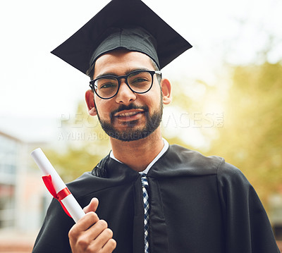 Buy stock photo Cropped shot of a happy graduate holding his diploma