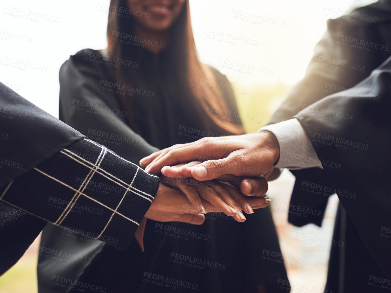 Buy stock photo People, graduates and unity with hands together for graduation, motivation or celebration at university. Closeup, group and students piling for teamwork, solidarity or mission on academic future