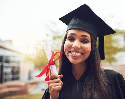 Buy stock photo Cropped shot of a happy young graduate standing outside