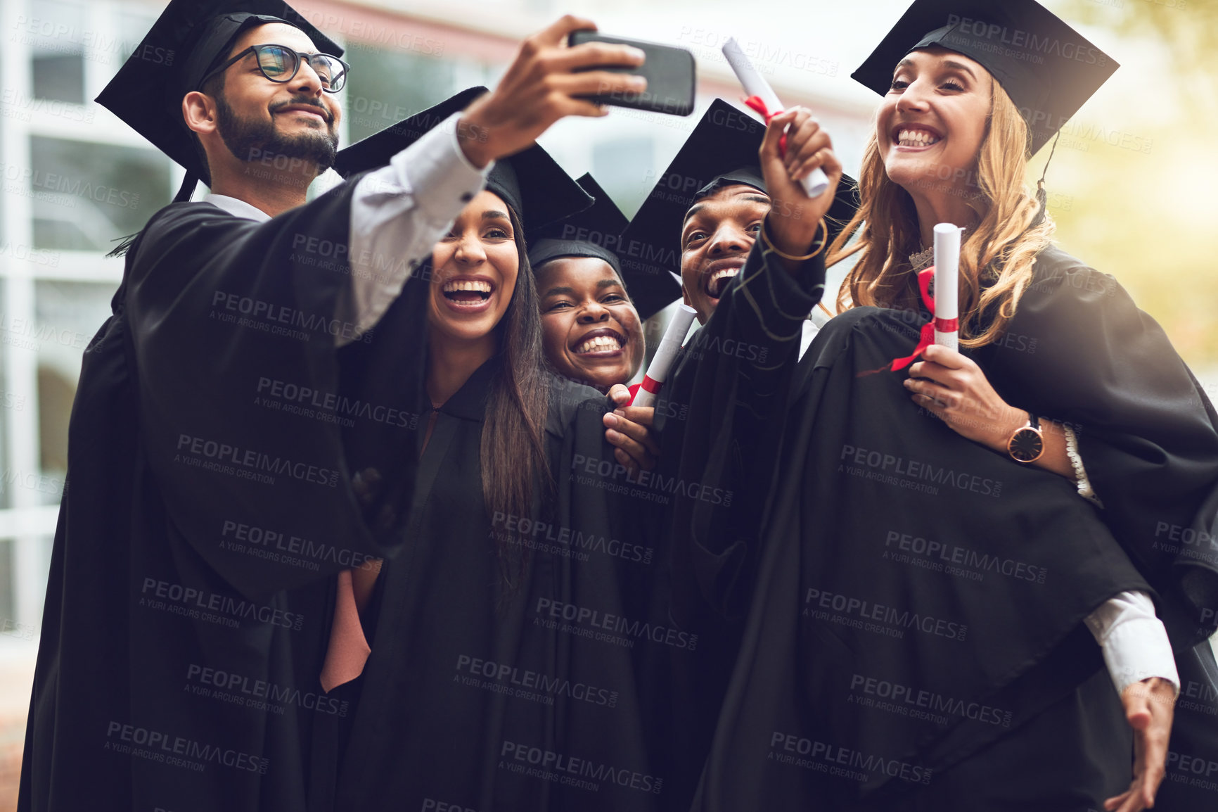 Buy stock photo Graduation, university and selfie with excited students for celebration, achievement and success in education. Photography, friends and happy people on college campus with diploma at award ceremony