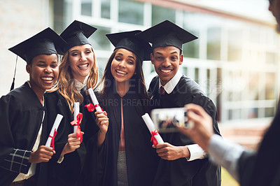 Buy stock photo Students, happy friends and picture for graduation with certificate to celebrate university milestone. Graduate, diploma and group photo of people with hand on phone for education, success and memory