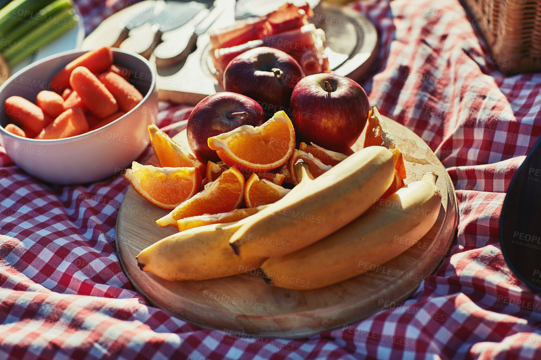 Buy stock photo Picnic, food and fruits closeup outdoor for healthy diet, organic nutrition or brunch. Blanket, lunch and snacks in summer with apple, orange and natural banana for fresh meal on holiday background