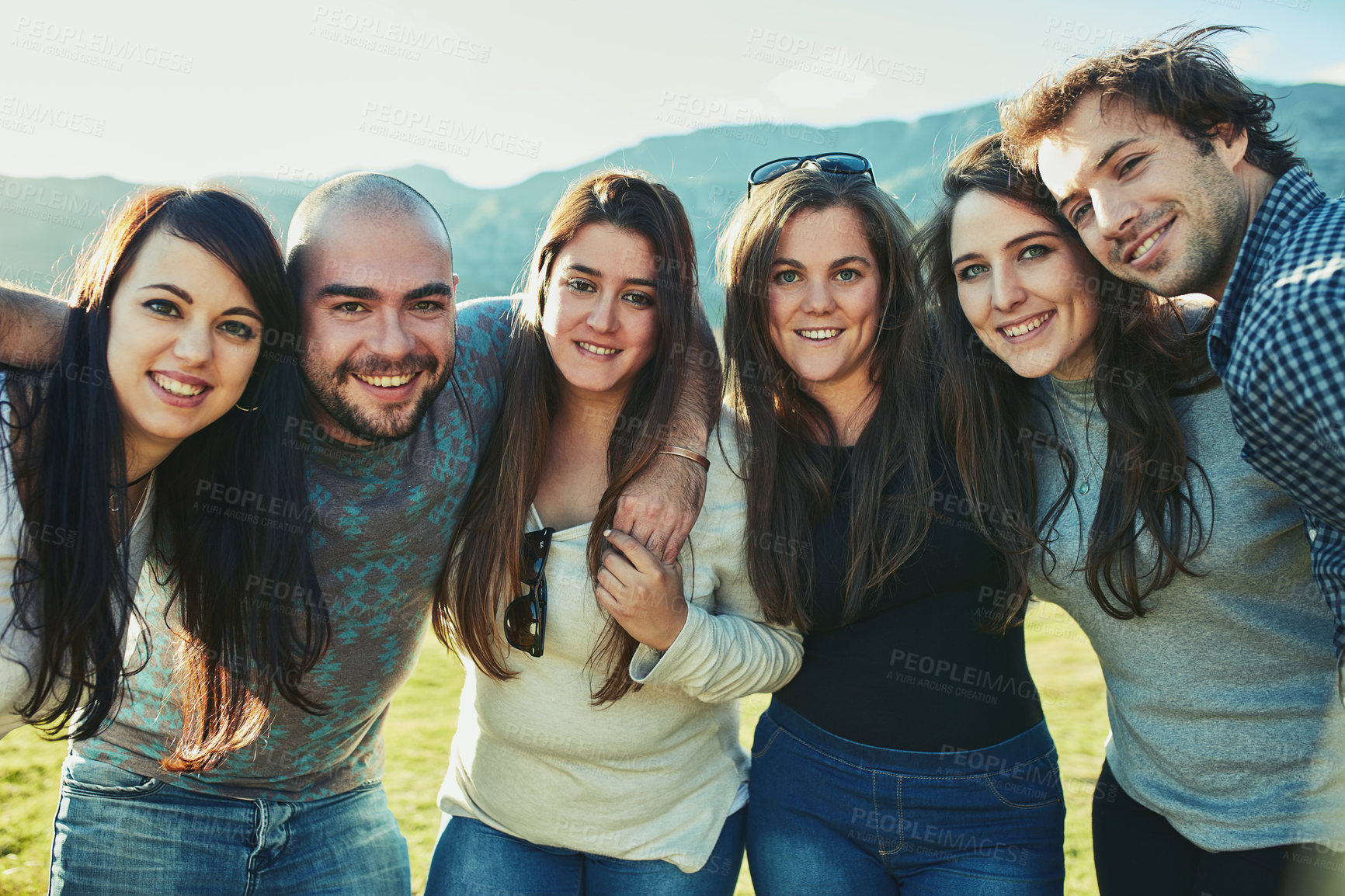 Buy stock photo Portrait of a group of friends enjoying some time outdoors together