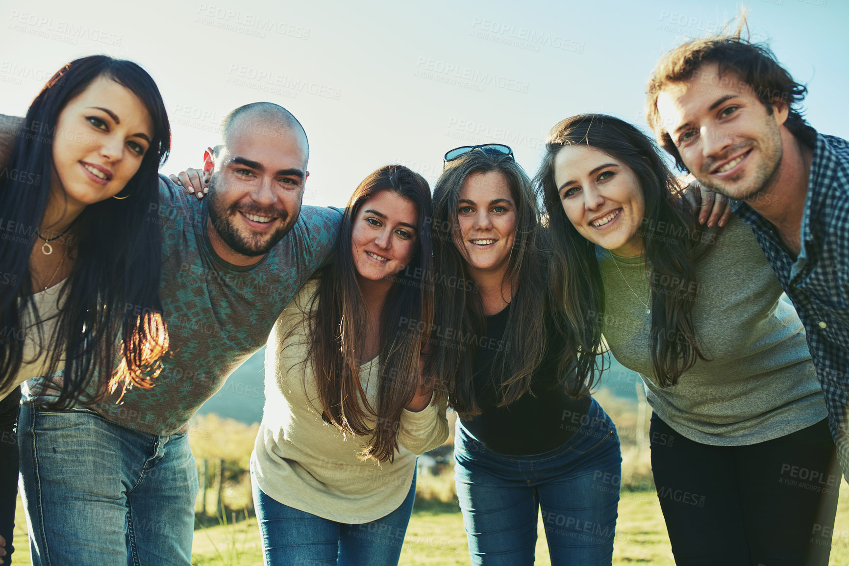 Buy stock photo Portrait of a group of friends enjoying some time outdoors together