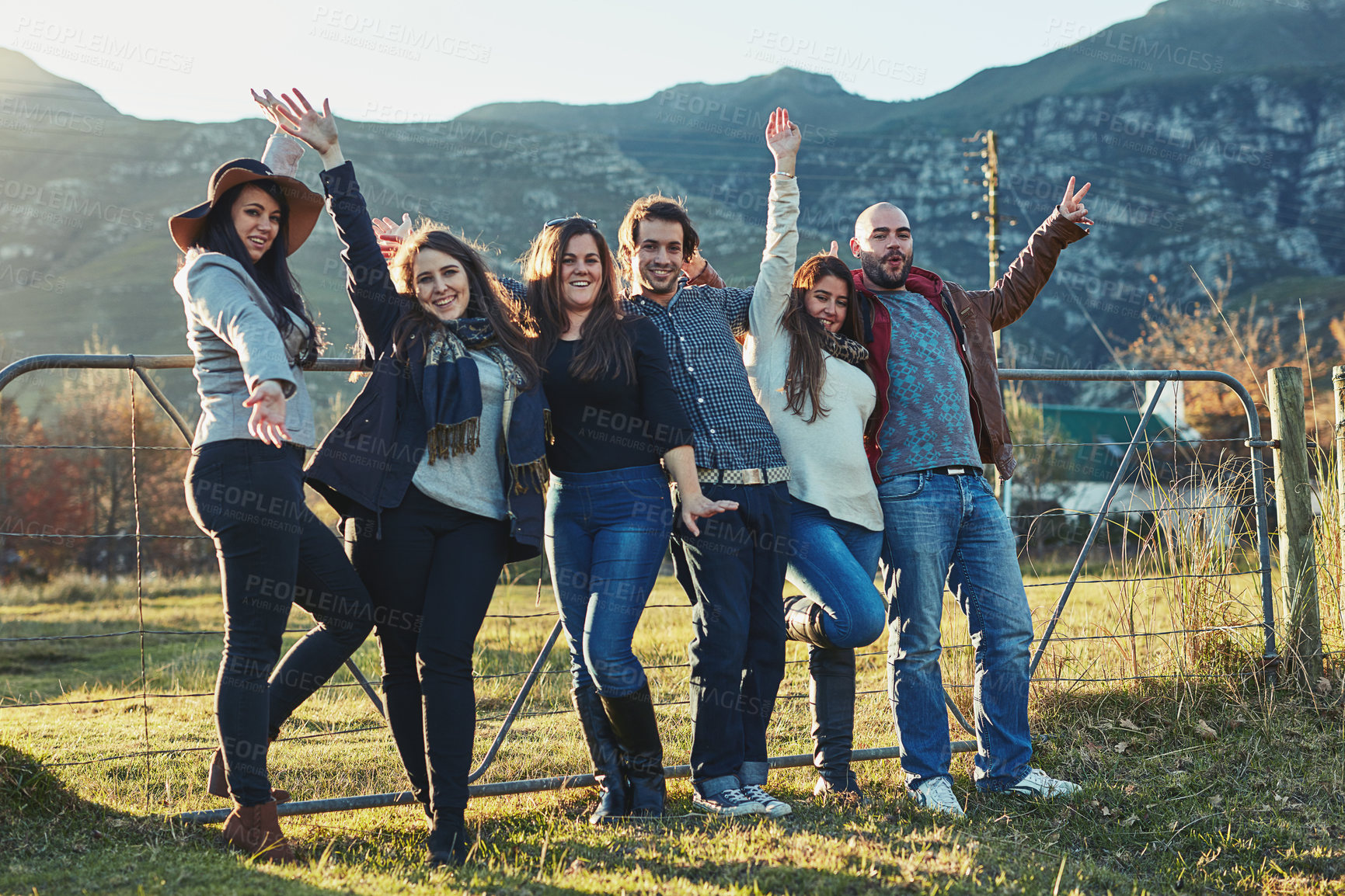 Buy stock photo Portrait of a group of friends enjoying some time outdoors together