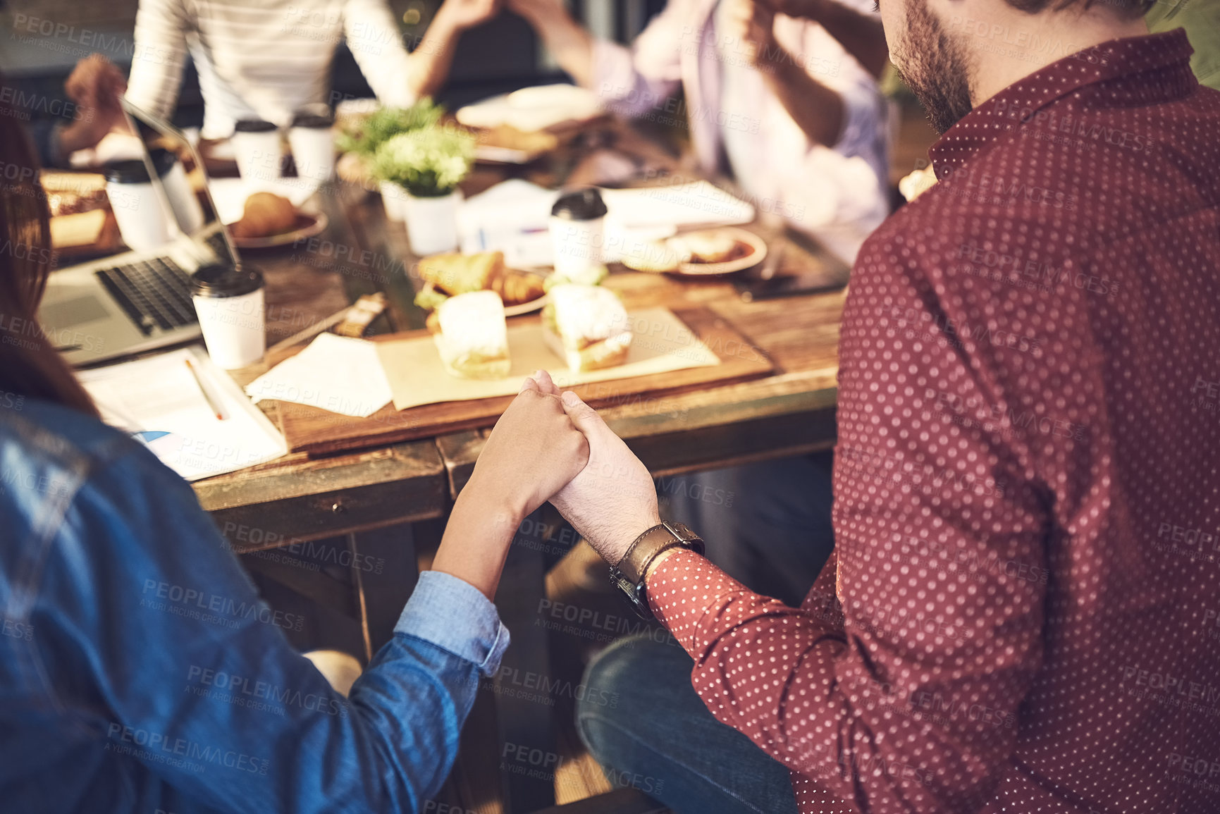 Buy stock photo Pray, group and people holding hands in restaurant, grace and Christian support with friends together or remote work. Lunch, break and praise or worship, saying thanks and creative business meeting