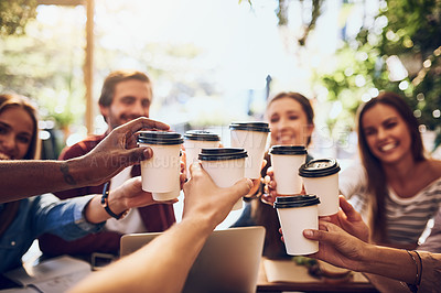 Buy stock photo Cropped shot of a group of friends toasting with cups of coffee while out together