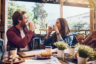 Buy stock photo Cropped shot of a happy young couple out for lunch at a cafe