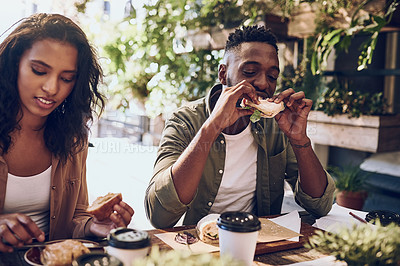Buy stock photo Cropped shot of a happy young couple out for lunch at a cafe