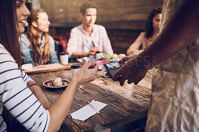 Buy stock photo Cropped shot of a woman ready to pay the bill at a cafe