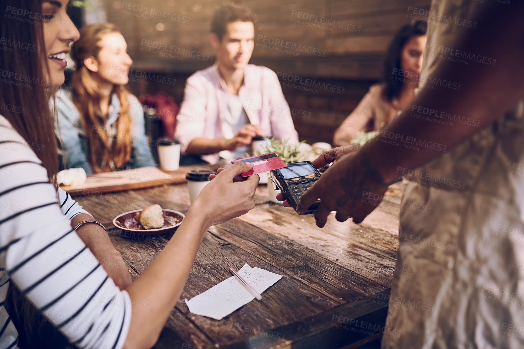 Buy stock photo Cropped shot of a woman ready to pay the bill at a cafe