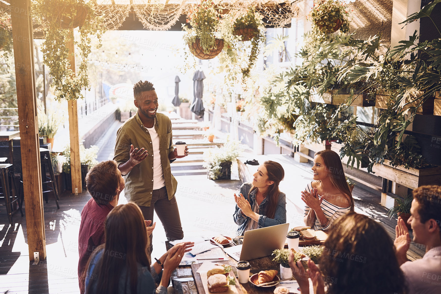 Buy stock photo Restaurant, business people and black man in meeting applause for discussion, planning and communication. Cafe, staff lunch and men and women clapping hands for team building, collaboration and ideas