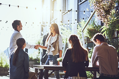 Buy stock photo Business people, team and handshake in meeting at coffee shop for welcome, b2b networking or remote work outdoor. Group, employees and shaking hands for onboarding, partnership deal and agreement