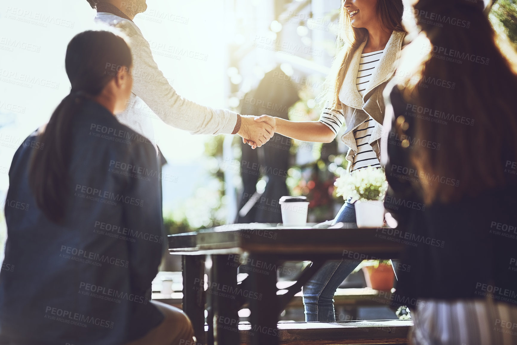 Buy stock photo Business people, team and handshake or happy at cafe for welcome, b2b networking or remote work outdoor. Collaboration, employees and shaking hands with hello for onboarding, partnership or agreement