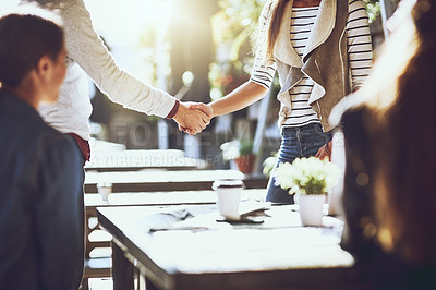 Buy stock photo Business people, hands and handshake in meeting at cafe for welcome, b2b networking and remote work outdoor. Group, employees and greeting for onboarding, partnership deal and happy for agreement