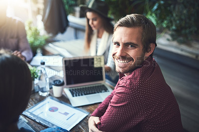Buy stock photo Portrait of a young designer having a meeting with his colleagues at a coffee shop
