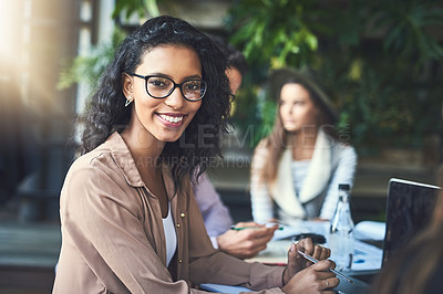 Buy stock photo Portrait of a young designer having a meeting with her colleagues at a coffee shop
