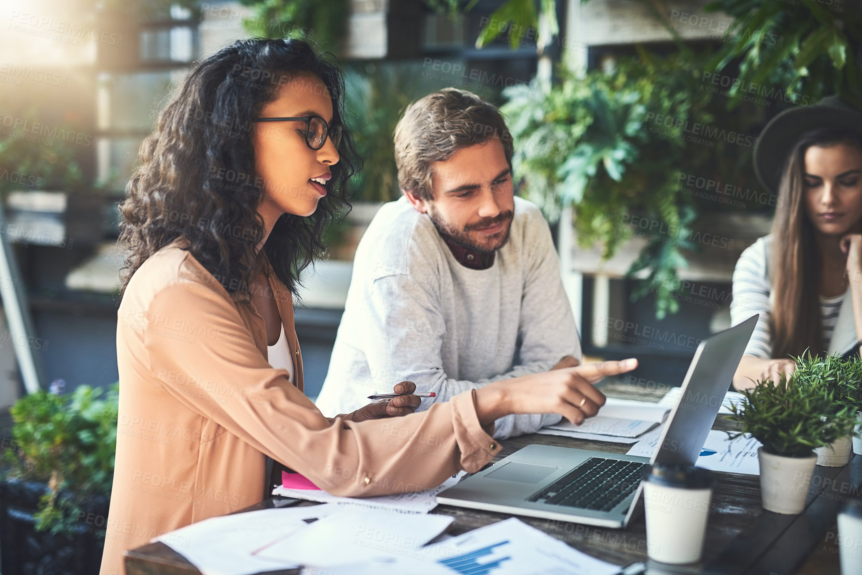 Buy stock photo Business people, teamwork and discussion with laptop in cafe for meeting, paperwork and remote work. Collaboration, data analysis and happy for brainstorming ideas with strategy, planning or solution