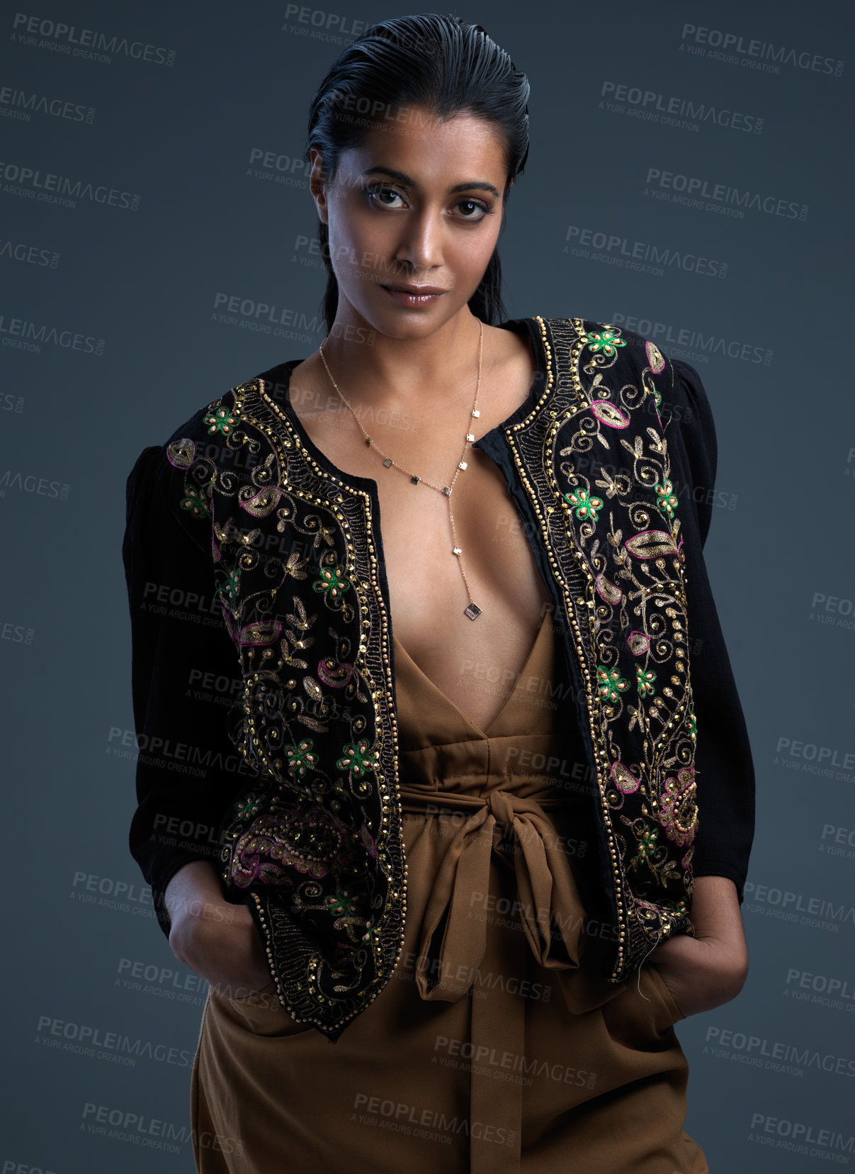 Buy stock photo Portrait, woman and fashion with clothes, streetwear and designer jacket on dark background. Female person, style and trendy in studio as edgy or casual with outfit, wardrobe and confidence in India