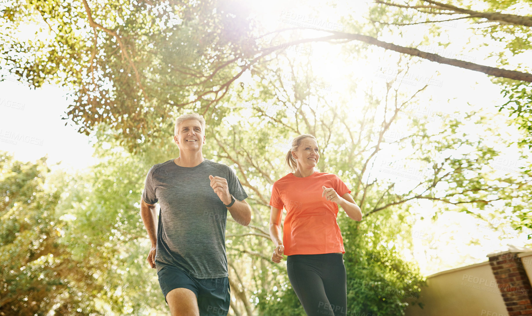 Buy stock photo Mature, couple and running exercise for outdoor workout or healthy cardio, training or wellness. Man, woman and fitness together for sports recovery or bonding with park jogging, marriage or nature