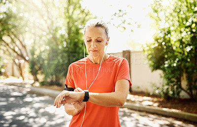 Buy stock photo Cropped shot of a mature woman out for her morning run
