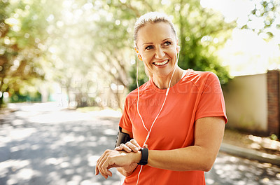 Buy stock photo Cropped shot of a mature woman out for her morning run