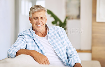Buy stock photo Cropped shot of a mature man relaxing on his sofa at home