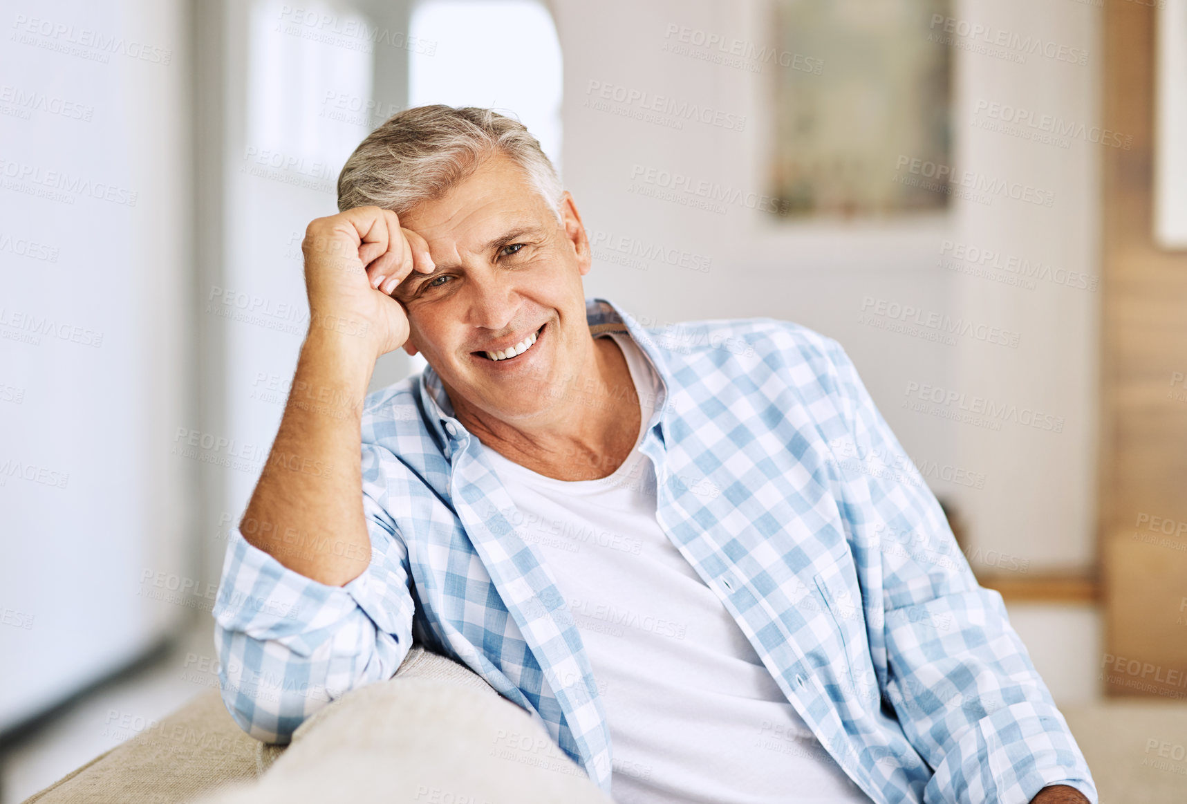 Buy stock photo Cropped shot of a mature man relaxing on his sofa at home