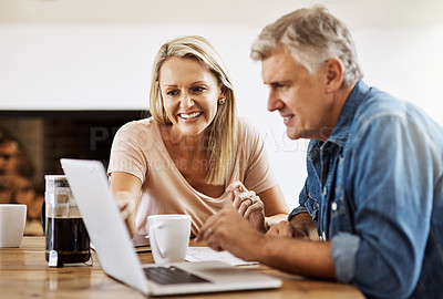 Buy stock photo Cropped shot of a mature couple using a laptop together